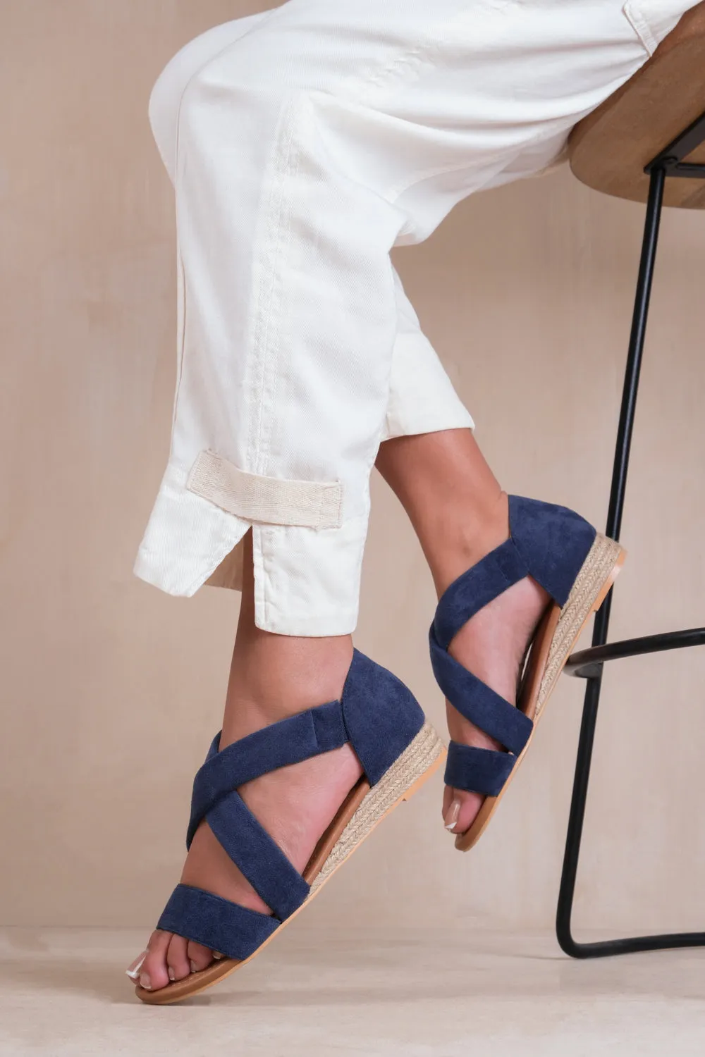 HUMMINGBIRD LOW WEDGE SHOES WITH CROSS OVER STRAP IN NAVY SUEDE